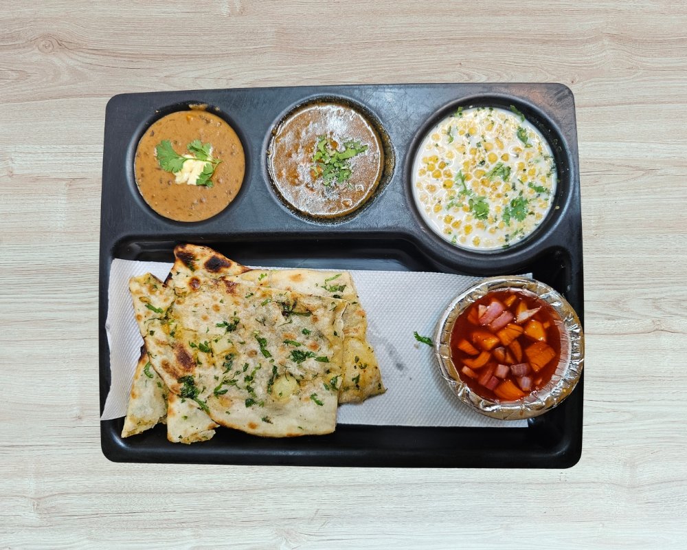 Amritsari Chur Chur Naan Thali at Apna Chole Point